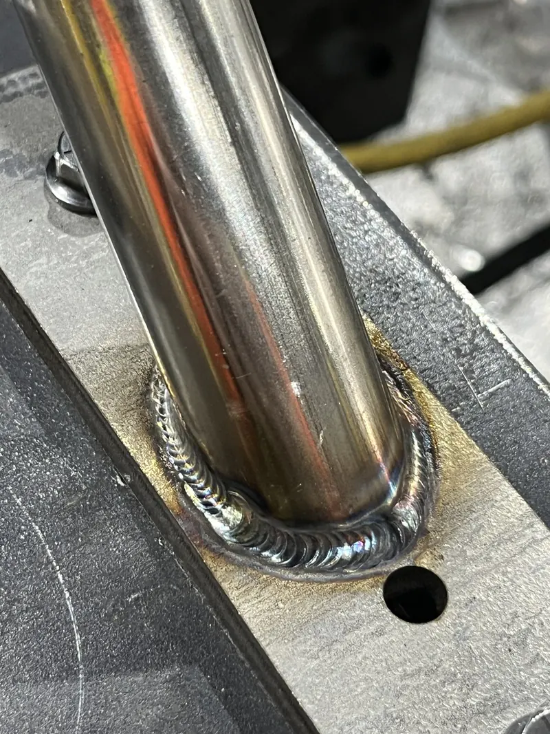 Tube welded to bracket, welding job by KC Ironcore