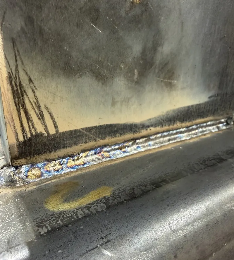 Fresh seam weld on a steel frame, welding job by KC Ironcore