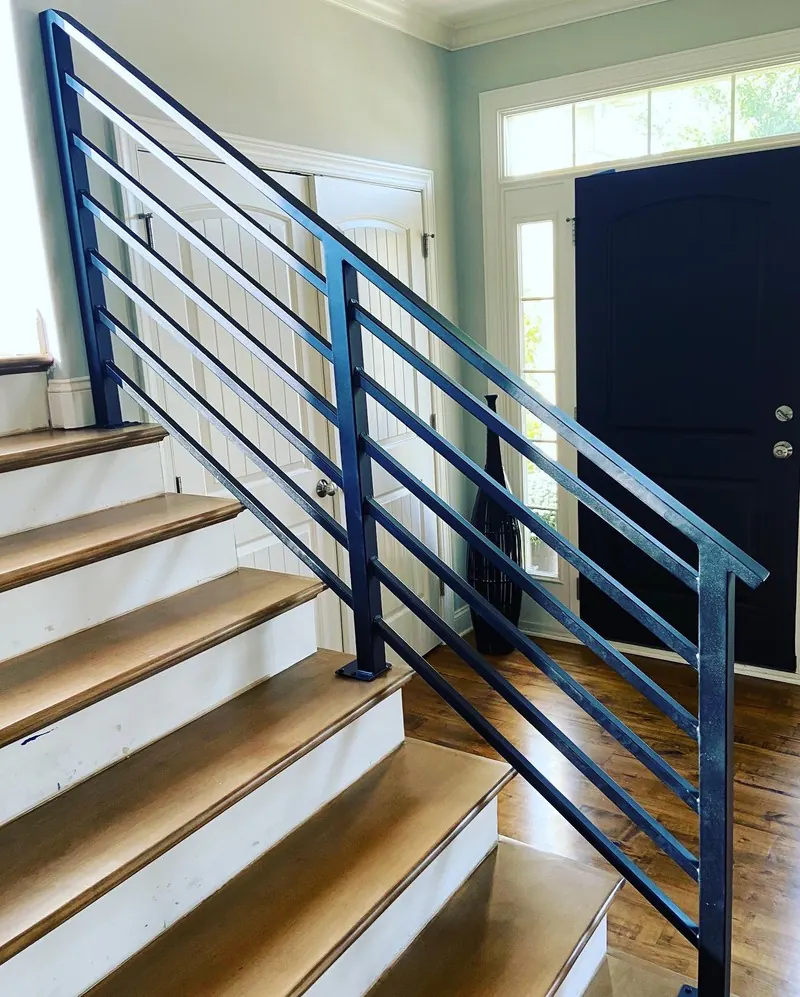 Horizontal-bar stair railing, welding job by KC Ironcore