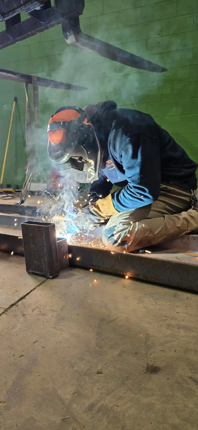 Welding a steel frame in the shop