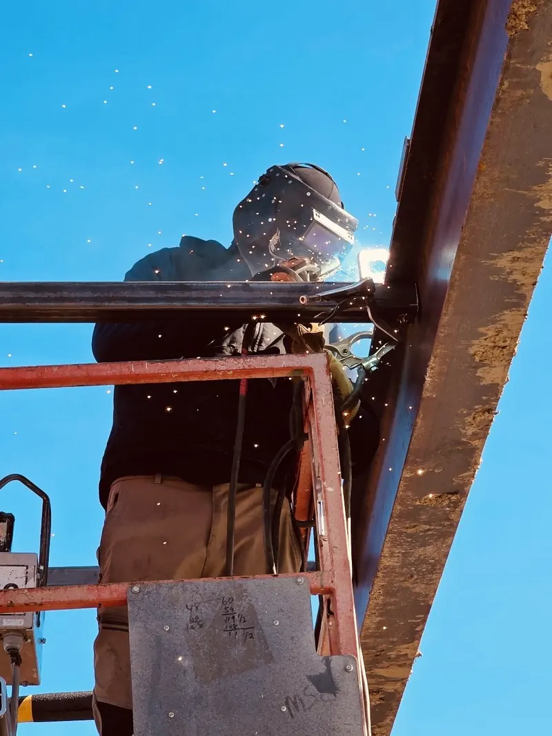 Welding a structural beam up on the lift